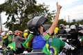 Juciane Cunha vibrates on the back of the motorcycle on the motorcycle with the president