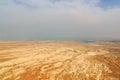 Judaean Desert panorama with wadis and salt lake dead sea seen from Masada fortress, Israel