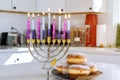 Judaism tradition family religious holiday symbols lighting hanukkiah menorah candles during Hanukkah celebrations Royalty Free Stock Photo