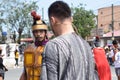 Judas iscariot confronted by rude roman soldier, street drama, community celebrates Good Friday representing the events that led t