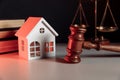 Judge auction and real estate concept. House model and gavel Royalty Free Stock Photo