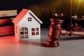 Judge auction and real estate concept. House model and gavel close-up Royalty Free Stock Photo