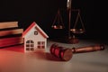 Judge auction and real estate concept. House model and gavel on a table Royalty Free Stock Photo