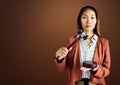 Judge with balance scale and hammer in front of brown background Royalty Free Stock Photo