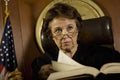 Judge With Book Looking Away In Court Room