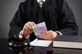 Judge Counting Euro Banknote