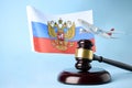 Judge gavel, airplane and Flag of Russia on blue background Royalty Free Stock Photo