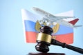 Judge gavel, airplane and Flag of Russia on blue background Royalty Free Stock Photo