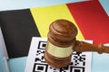 Judge gavel, barcode sheet and Belgian flag, the concept of administrative punishment for violation of the regime using QR codes Royalty Free Stock Photo