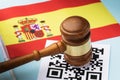 Judge gavel, barcode sheet and Spanish flag, the concept of administrative punishment for violation of the regime using QR codes Royalty Free Stock Photo