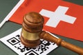 Judge gavel, barcode sheet and Swiss flag, the concept of administrative punishment for violation of the regime using QR codes Royalty Free Stock Photo