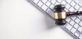 Judge gavel with computer keyboard. Concept of internet crime Royalty Free Stock Photo