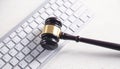 Judge gavel with computer keyboard. Concept of internet crime Royalty Free Stock Photo