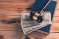 Judge gavel with dollars and law books Royalty Free Stock Photo