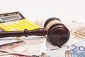 Judge gavel, euro banknotes and calculator