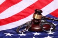 Judge Gavel and Handcuffs over American Flag