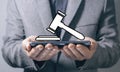 judge gavel icon. man holding in his hand Royalty Free Stock Photo