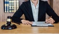 Judge gavel with Justice lawyers, Businesswoman in suit or lawyer working on a documents. Legal law, advice and justice concept Royalty Free Stock Photo