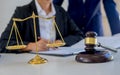 Judge gavel with Justice lawyers having team meeting at law firm Royalty Free Stock Photo