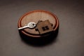 Judge gavel and key chain in shape of two splitted part of house on wooden background. Concept of real estate auction or Royalty Free Stock Photo