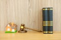 judge gavel law book & house model on wooden desk. real estate d Royalty Free Stock Photo