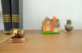judge gavel law book & house model on wooden desk. real estate d Royalty Free Stock Photo