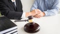 Judge gavel with lawyers advice legal at law firm in background. Royalty Free Stock Photo