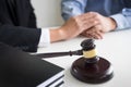 Judge gavel with lawyers advice legal at law firm in background. Royalty Free Stock Photo