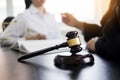 Judge gavel with lawyers advice legal at law firm in background. Royalty Free Stock Photo