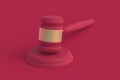 Judge gavel of magenta on red background. Color of the year 2023