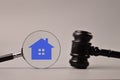 Judge gavel, magnifying glass and house symbol. Judge auction and real estate concept Royalty Free Stock Photo