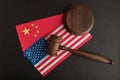 Judge gavel over US flag and China. Relationship between America and China