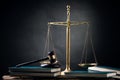 Judge gavel,scale, and books on table Royalty Free Stock Photo