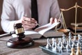 Judge gavel with scales of justice, male lawyers working having at law firm in office. Concepts of law advice and justice