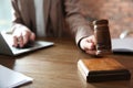 Judge with gavel at table in courtroom. Law and justice concept Royalty Free Stock Photo