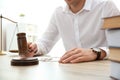 Judge with gavel at table in courtroom. Law and justice concept Royalty Free Stock Photo