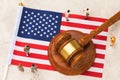 Judge gavel, USA flag and plastic toy men, American Society litigation concept Royalty Free Stock Photo