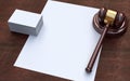 Judge gavel, white paper and business cards