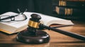 Judge gavel on a wooden desk, law books background Royalty Free Stock Photo