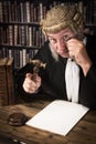 Judge looking through monocle Royalty Free Stock Photo