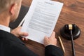 Judge reading contract paper Royalty Free Stock Photo