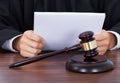 Judge reading documents at desk Royalty Free Stock Photo