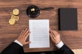 Judge Reading Paper In Courtroom