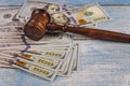 Judge& x27;s gavel, banknotes of American dollars on the business, finance corruption money financial crime