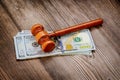 Judge's gavel, banknotes of American dollars on the business, finance corruption money financial crime Royalty Free Stock Photo
