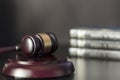 Judge`s gavel on black table with law books on the background. Law and justice concept Royalty Free Stock Photo