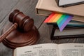 Judge`s gavel, book and rainbow