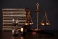 Judge`s gavel, books, scales of justice and hourglass on wooden table. Law and justice concept Royalty Free Stock Photo