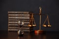 Judge`s gavel, books, scales of justice and hourglass on wooden table. Law and justice concept Royalty Free Stock Photo