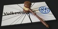 Broken logo of VOLKSWAGEN and judge's gavel. Editorial conceptual 3d rendering